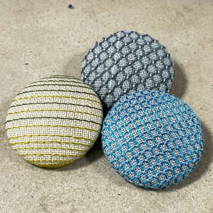 Tille's broderede knapper